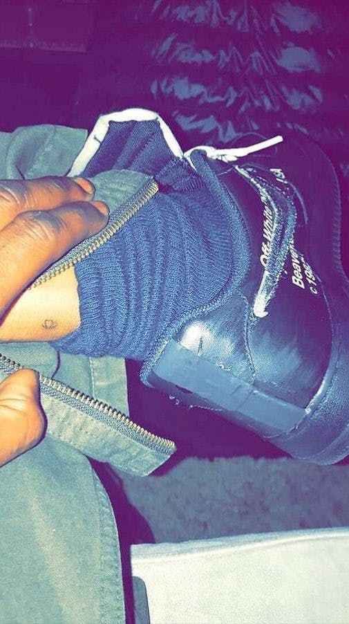 Travis Scott Kylie Jenner inked matching tattoos of a butterfly on his left ankle and her right ankle