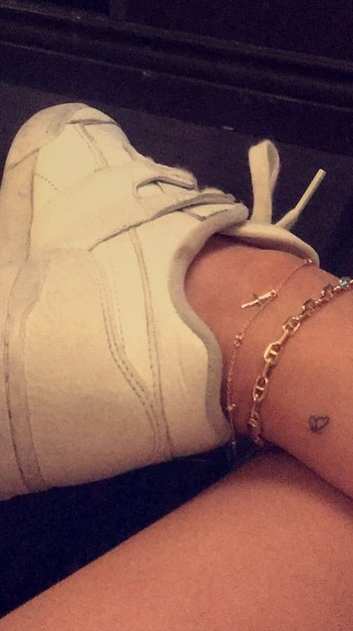 Travis Scott Kylie Jenner inked matching tattoos of a butterfly on his left ankle and her right ankle